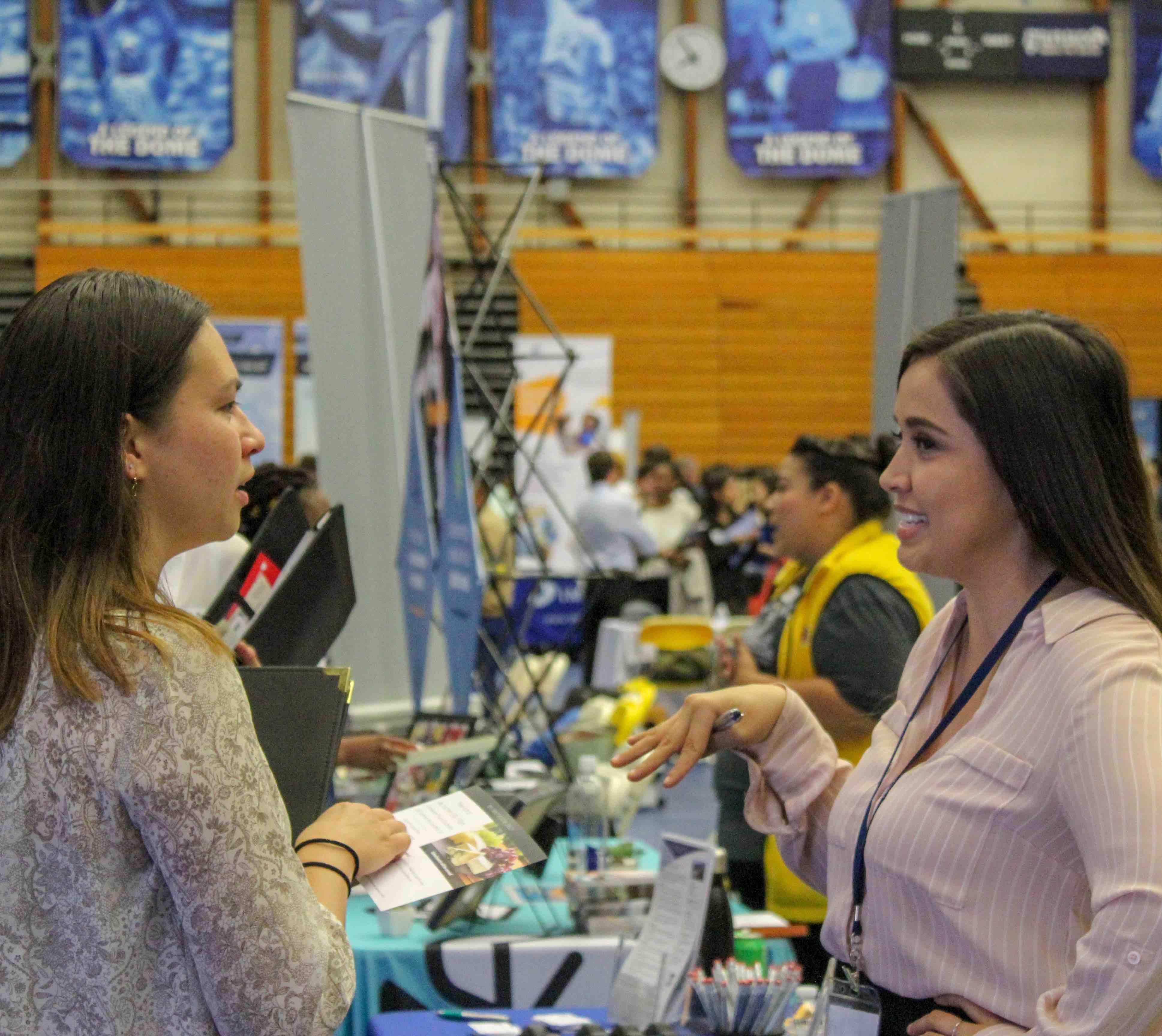 photo of student talking with industry professional